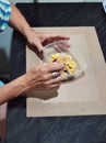 woman's hands eating sliced Ã¢â¬â¹Ã¢â¬â¹banana with Peruvian maca oats in a clear pot with spoon